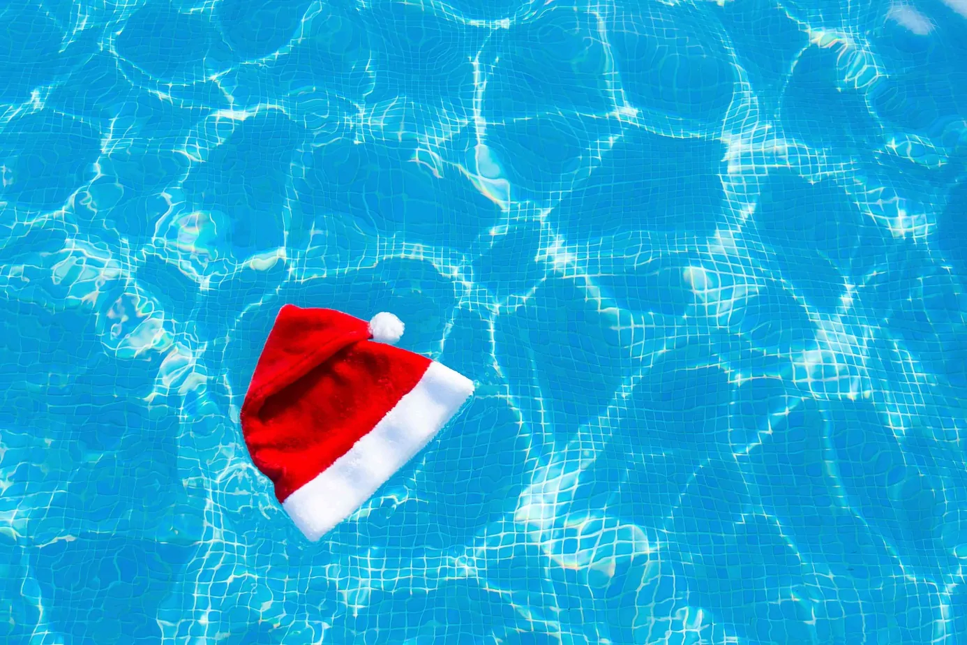 A Santa hat floating on water.